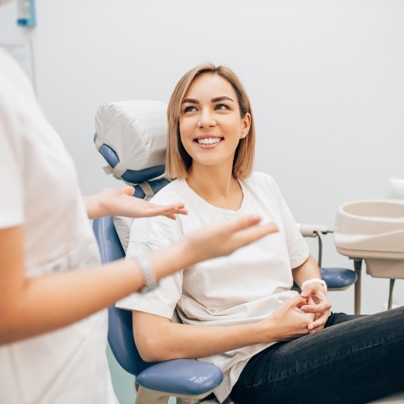 Woman smiling during dental hygiene visit