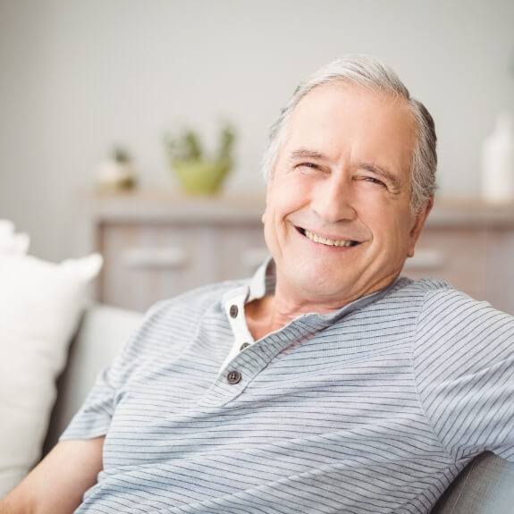 Smiling man enjoying the benefits of dental implants