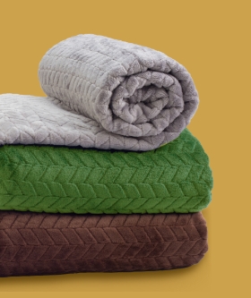 Stack of three folded blankets
