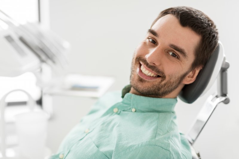 a dental patient smiling during his checkup
