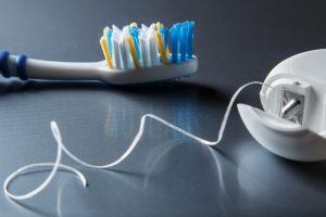 white dental floss toothbrush