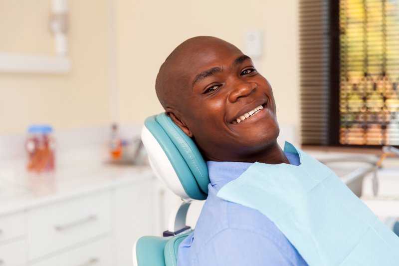 a man in a dentist chair