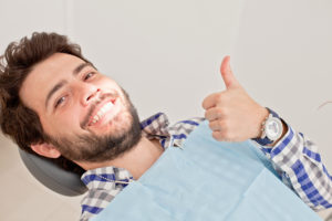 man happily visiting dentist in Dublin