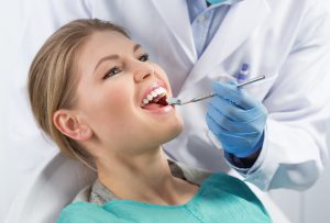 woman with mouth open dental exam