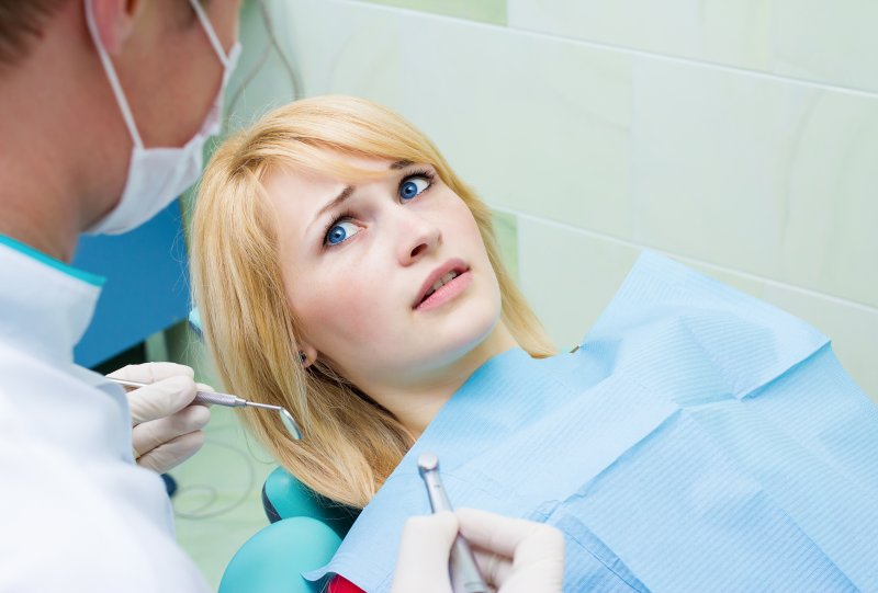 Woman experiencing anxiety at dental appointment